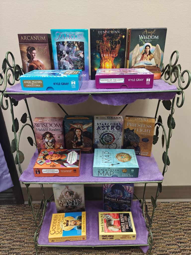 shelf of tarot and oracle cards